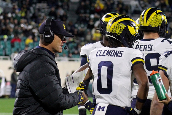 Jim Harbaugh, Darrius Clemons (0), and Jeffrey Persi (79)