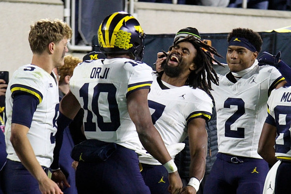 J.J. McCarthy (9), Alex Orji (10), Donovan Edwards (7), and Will Johnson (2)
