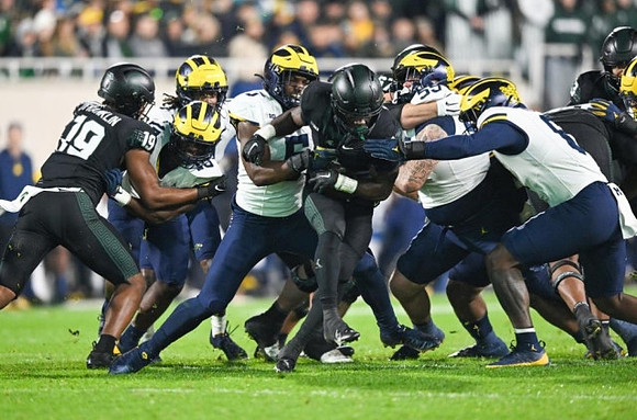 Zeke Berry (10), Josaiah Stewart (5), Mason Graham (55), and Derrick Moore (8)