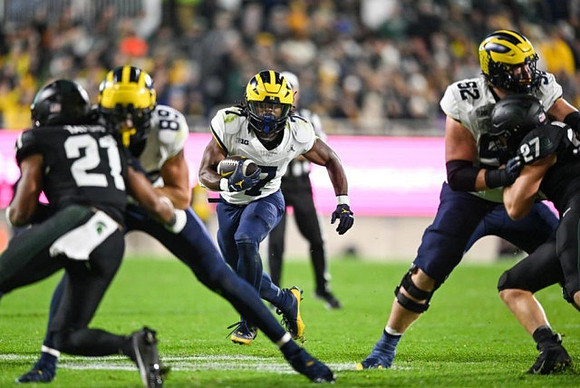 AJ Barner (89), Donovan Edwards (7), and Karsen Barnhart (52)