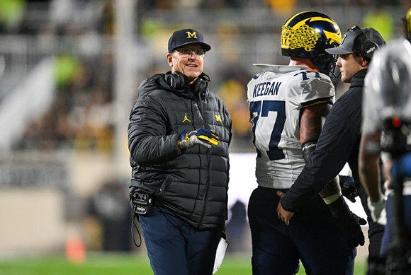 Jim Harbaugh and Trevor Keegan (77)