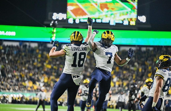 Colston Loveland (18), Donovan Edwards (7), and AJ Barner (89)