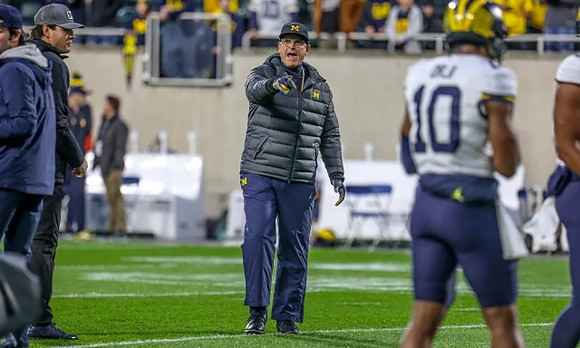 Jim Harbaugh and Alex Orji (10)