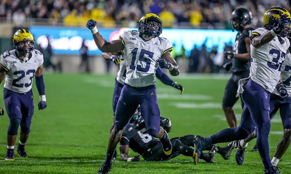 Michael Barrett (23), Ernest Hausmann (15), and Jaylen Harrell (32)