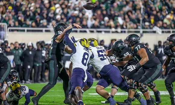 Quinten Johnson (28), Derrick Moore (8), and Mason Graham (55)