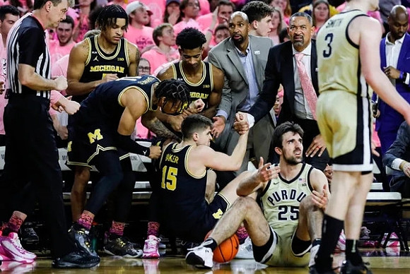 Joey Baker (15) and Michigan Team