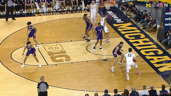 Hunter Dickinson (1), Terrance Williams II (5), and Brandon Johns Jr. (23)