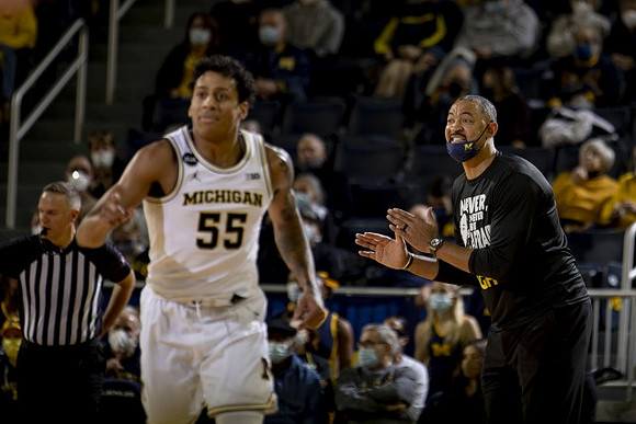 Eli Brooks (55) and Juwan Howard