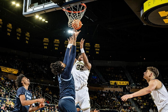Tarris Reed Jr. (32) and Will Tschetter (42)