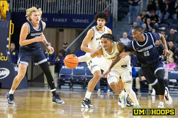Olivier Nkamhoua (13) and Dug McDaniel (0)