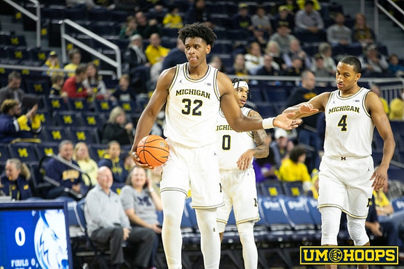Tarris Reed Jr. (32), Dug McDaniel (0), and Nimari Burnett (4)
