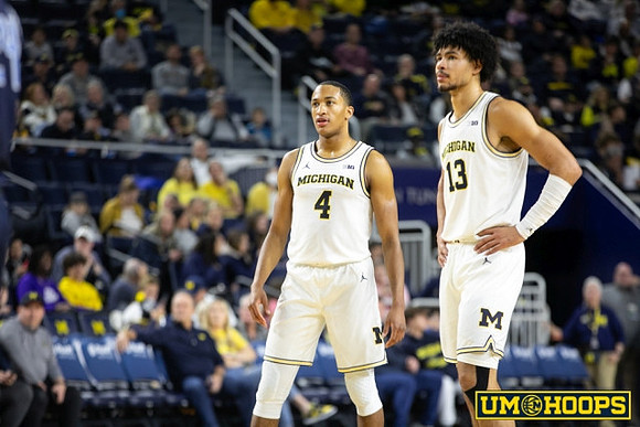 Nimari Burnett (4) and Olivier Nkamhoua (13)