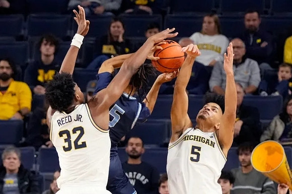 Tarris Reed Jr. (32) and Terrance Williams II (5)
