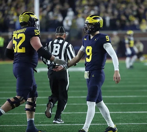 Karsen Barnhart (52) and J.J. McCarthy (9)