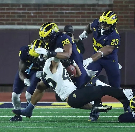 Will Johnson (2), Junior Colson (25), and Michael Barrett (23)
