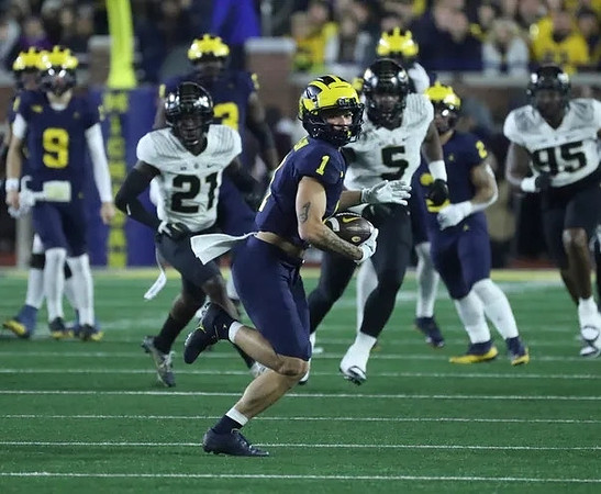 J.J. McCarthy (9), LaDarius Henderson (73), Roman Wilson (1), and Blake Corum (2)