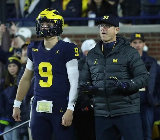 J.J. McCarthy (9) and Jim Harbaugh