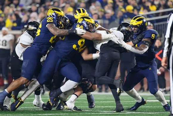 Junior Colson (25), Kris Jenkins (94), and Josaiah Stewart (5)