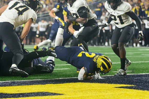 J.J. McCarthy (9), AJ Barner (89), and Blake Corum (2)