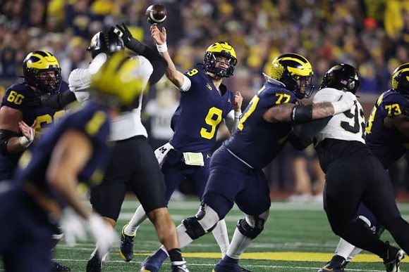 Drake Nugent (60), Roman Wilson (1), J.J. McCarthy (9), Trevor Keegan (77), and LaDarius Henderson (73)