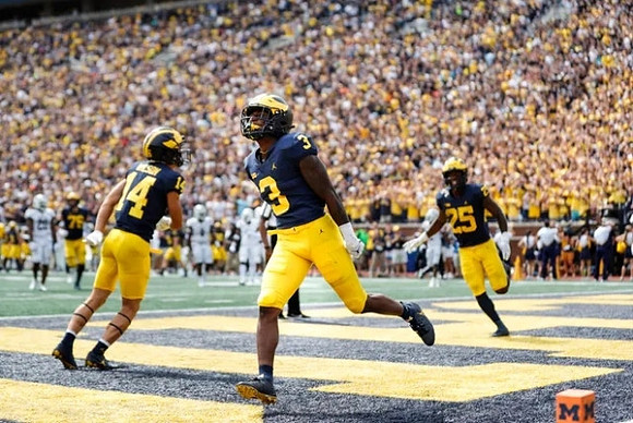 A.J. Henning (3), Roman Wilson (14), and Hassan Haskins (25)