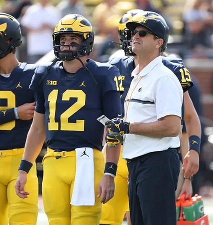Cade McNamara (12), Jim Harbaugh, and Alan Bowman (15)