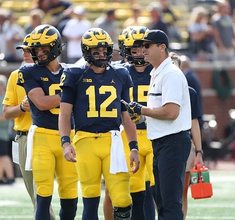 J.J. McCarthy (9), Cade McNamara (12), Alan Bowman (15), and Jim Harbaugh