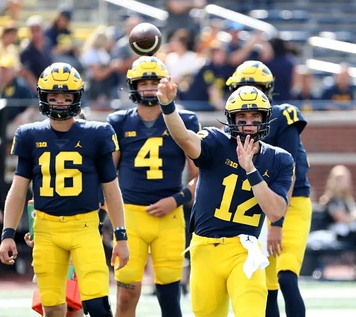 Davis Warren (16), Dan Villari (4), Cade McNamara (12), and Peyton Smith (17)