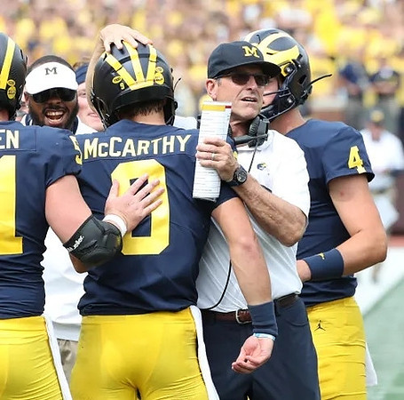 Greg Crippen (51), J.J. McCarthy (9), Jim Harbaugh, and Dan Villari (4)