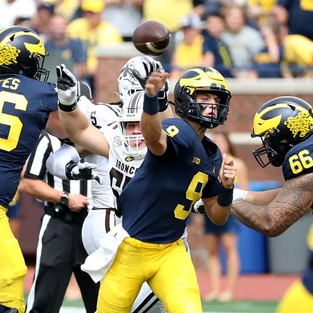 Ryan Hayes (76), J.J. McCarthy (9), and Chuck Filiaga (66)