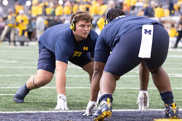 Mason Graham (55) and Kenneth Grant (78)