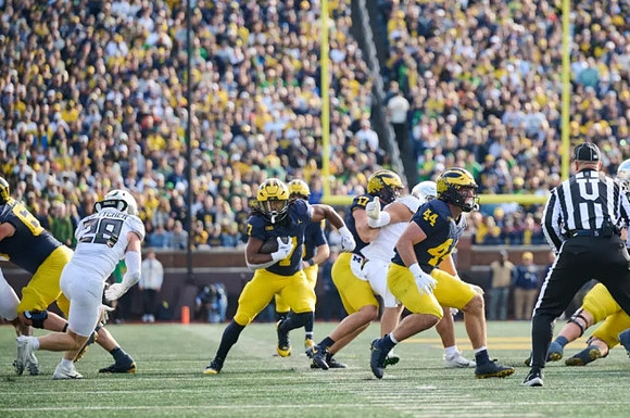 Donovan Edwards (7), Marlin Klein (17), and Max Bredeson (44)