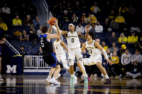 Nimari Burnett (4), Dug McDaniel (0), and Olivier Nkamhoua (13)