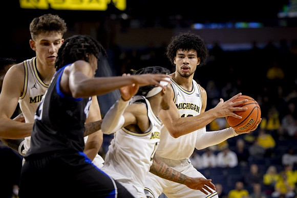 Will Tschetter (42), Dug McDaniel (0), and Olivier Nkamhoua (13)