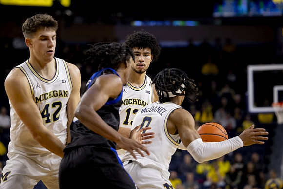 Will Tschetter (42), Dug McDaniel (0), and Olivier Nkamhoua (13)