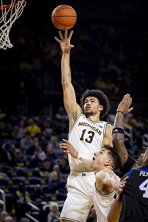 Olivier Nkamhoua (13) and Will Tschetter (42)