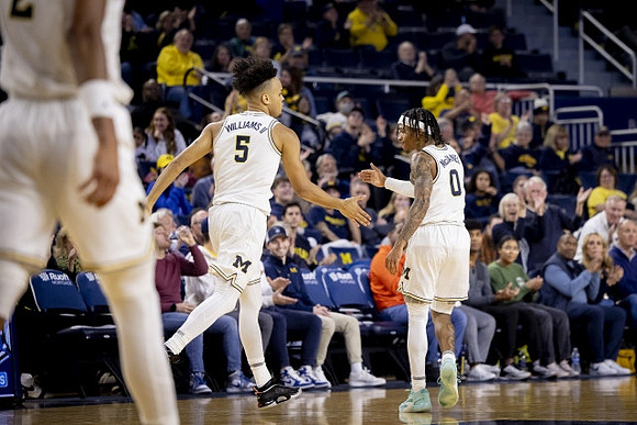 Terrance Williams II (5) and Dug McDaniel (0)