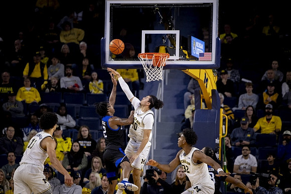 Olivier Nkamhoua (13), George Washington III (40), and Tarris Reed Jr. (32)