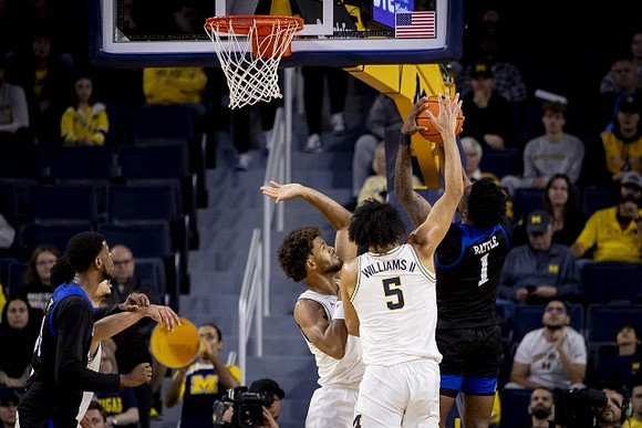 Terrance Williams II (5) and Dug McDaniel (0)