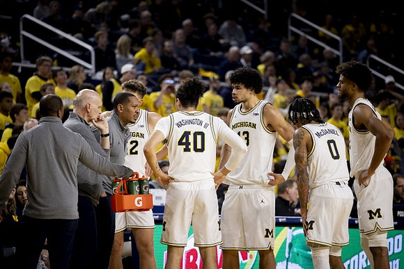 Phil Martelli, Howard Eisley, Will Tschetter (42), George Washington III (40), Olivier Nkamhoua (13), Dug McDaniel (0), and Tray Jackson (2)