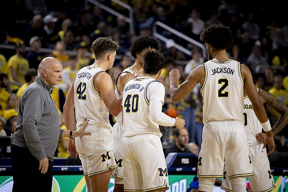 Phil Martelli, Will Tschetter (42), George Washington III (40), Olivier Nkamhoua (13), Tray Jackson (2), and Dug McDaniel (0)