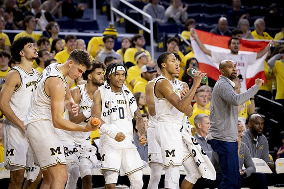 Saddi Washington and Michigan Team