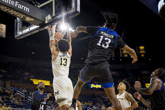 Olivier Nkamhoua (13) and Terrance Williams II (5)