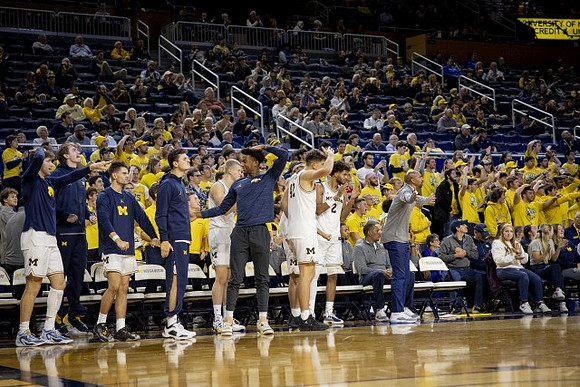 Saddi Washington and Michigan Team