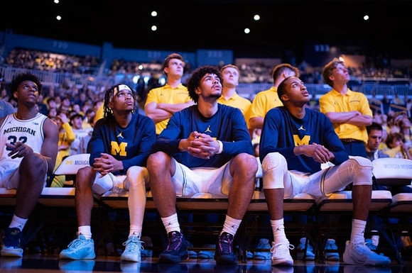 Tarris Reed Jr. (32), Dug McDaniel (0), Olivier Nkamhoua (13), and Nimari Burnett (4)