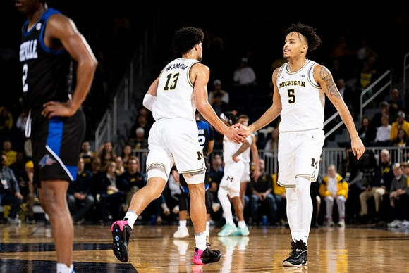 Olivier Nkamhoua (13) and Terrance Williams II (5)