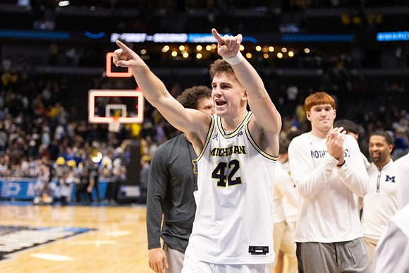 Will Tschetter (42) and Michigan Team