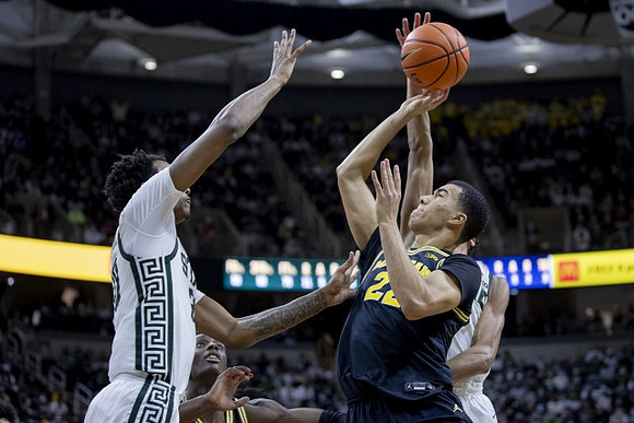 Moussa Diabate (14) and Caleb Houstan (22)