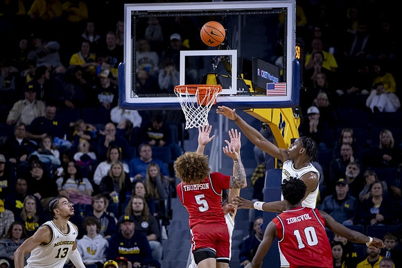 Olivier Nkamhoua (13) and Tarris Reed Jr. (32)