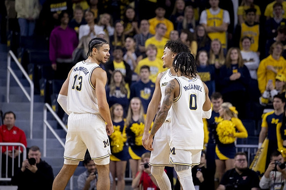 Olivier Nkamhoua (13), Terrance Williams II (5), and Dug McDaniel (0)